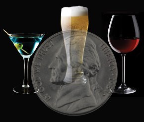 a martini glass, a beer glass, and a wine glass in front of a nickel