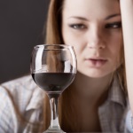 A young woman is ambivalent about wine