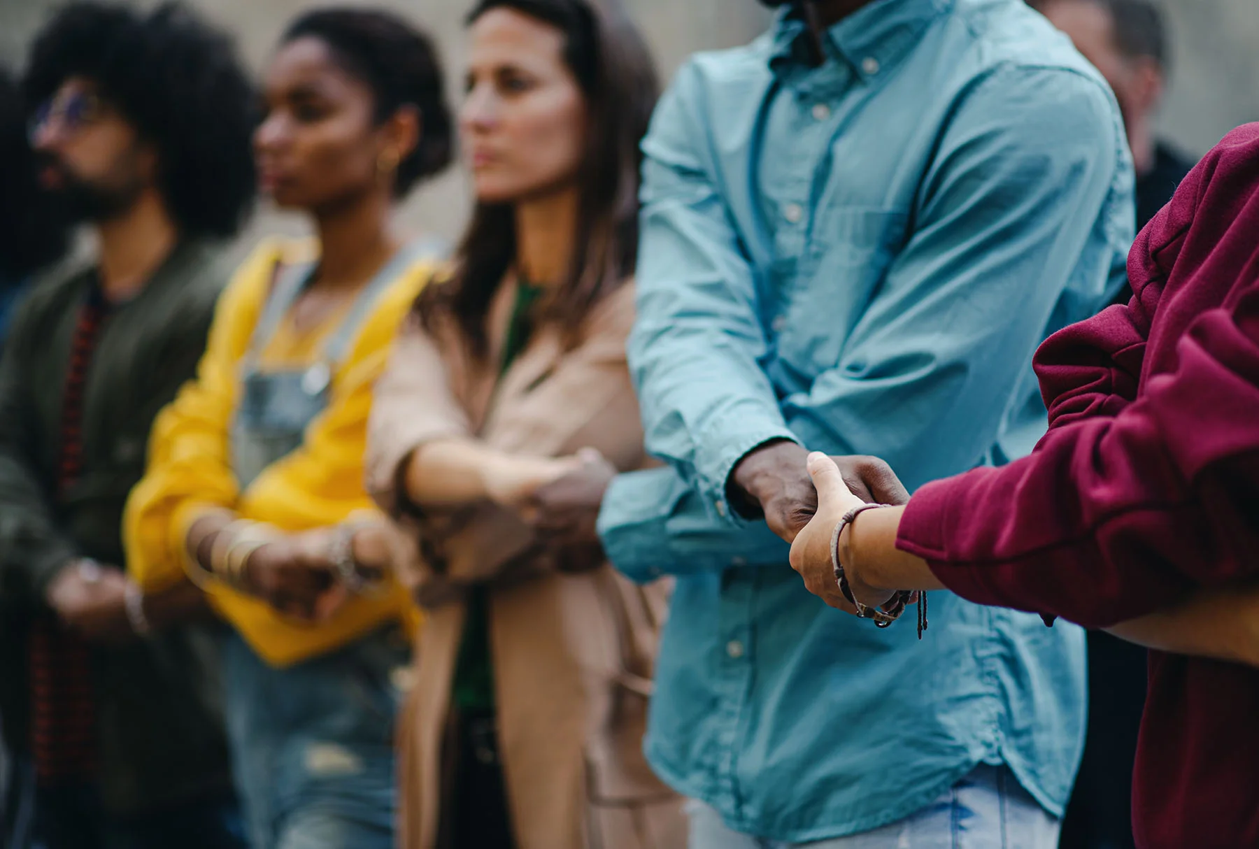 People creating a block change with hands held